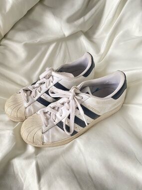 adidas White Sneakers with Black Stripes and Gold Accent